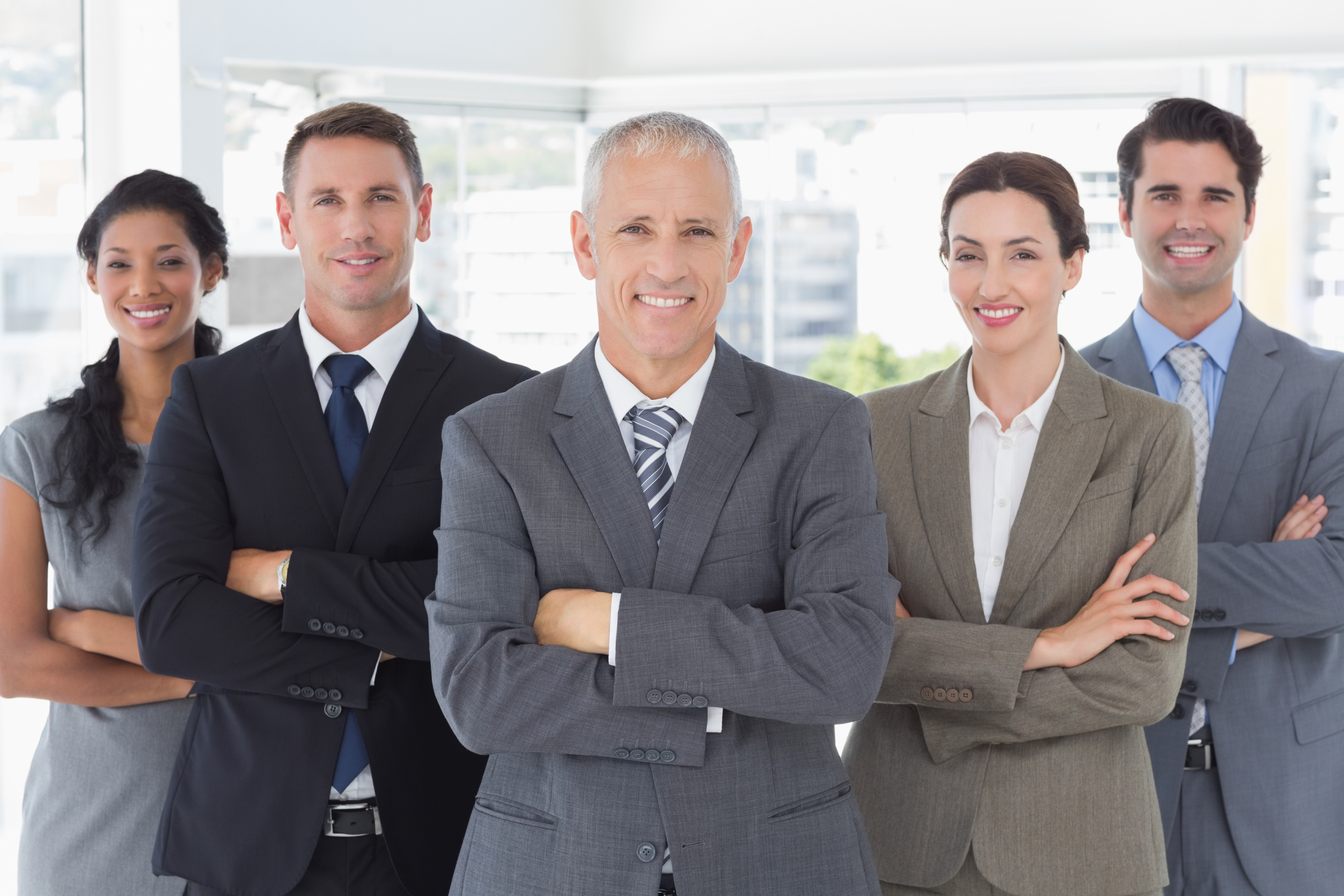 Business colleagues standing in a row in the office